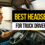 Focused truck driver wearing a wireless headset while driving on the highway — representing the best headsets for truck drivers to ensure safe, hands-free communication on the road.