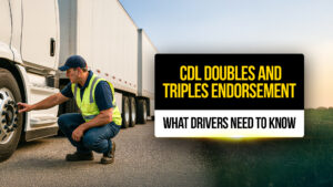 CDL truck driver inspecting the front wheel of a semi-truck with a double trailer — representing a guide to doubles and triples endorsement requirements and safety checks.